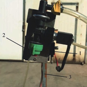 Nozzle tilt angle adjustment device